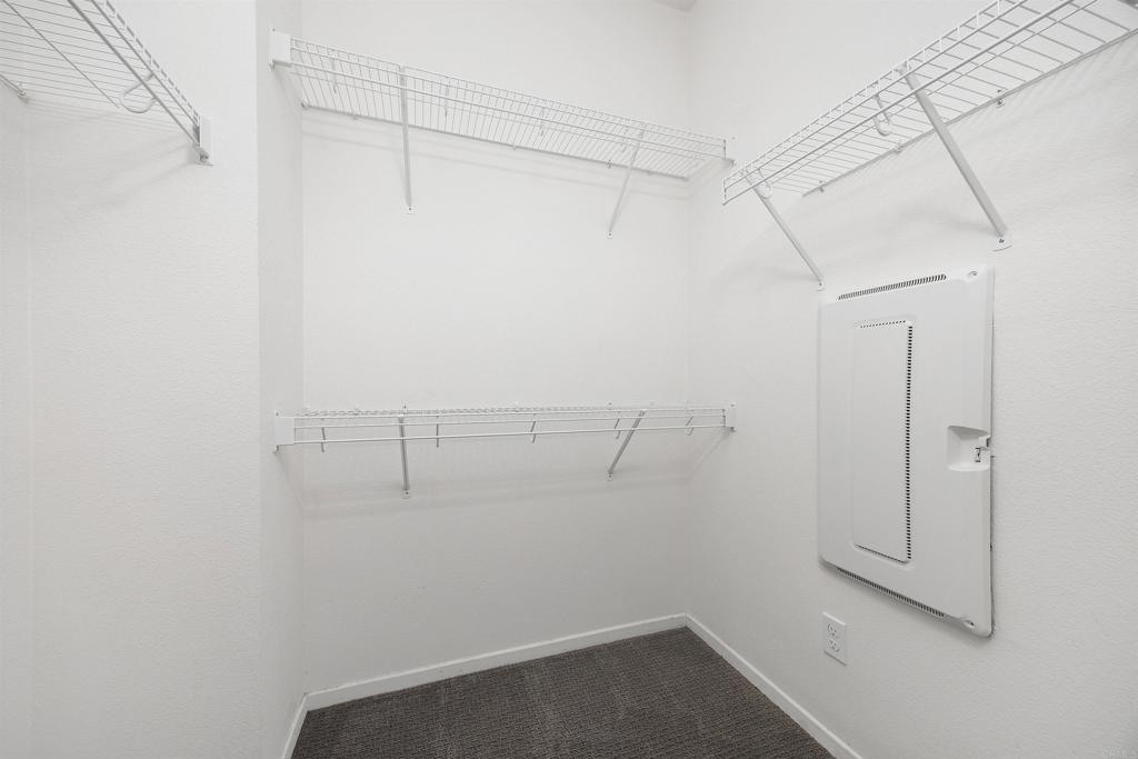1309 Via Lucero Oceanside, CA 92056 - Photo 25 of 50 a view of a room with racks on the wall