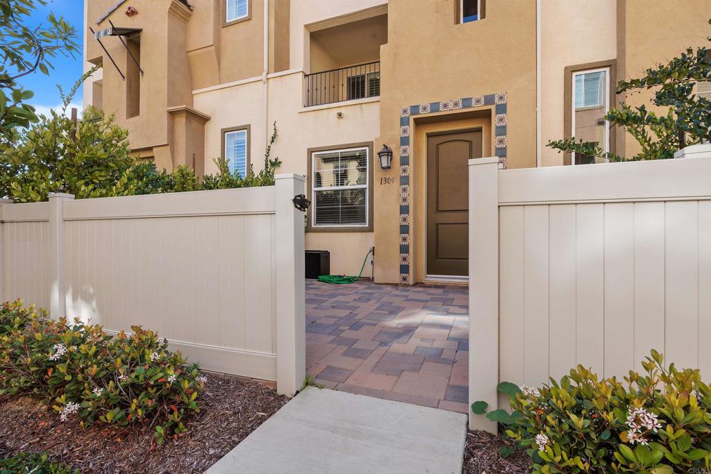 1309 Via Lucero Oceanside, CA 92056 - Photo 3 of 50 front view of a house with a yard