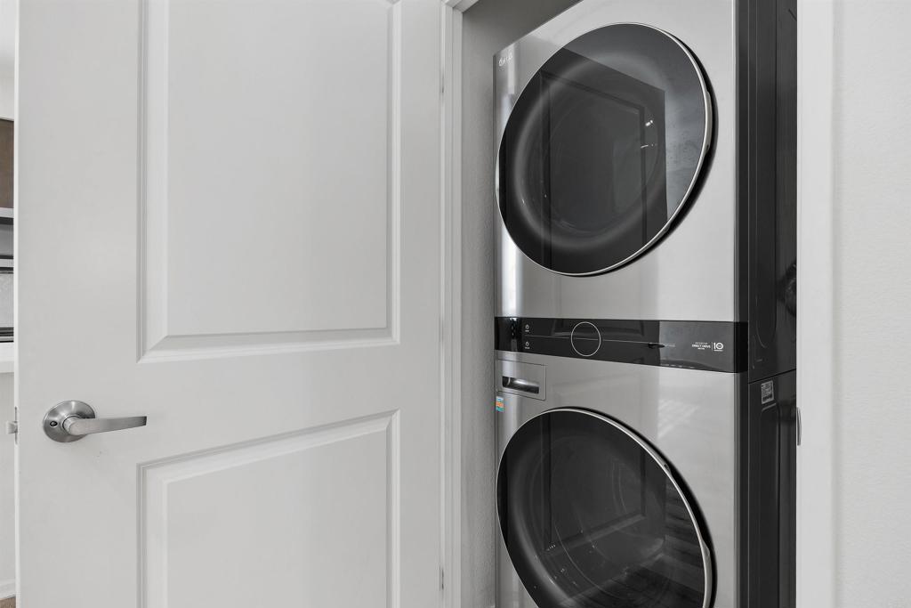 1309 Via Lucero Oceanside, CA 92056 - Photo 38 of 50 a close view of a utility room with dryer and washer