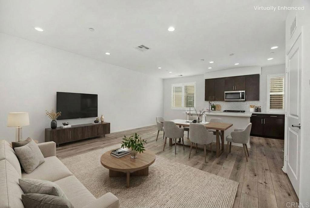 1309 Via Lucero Oceanside, CA 92056 - Photo 6 of 50 a living room with furniture and a flat screen tv