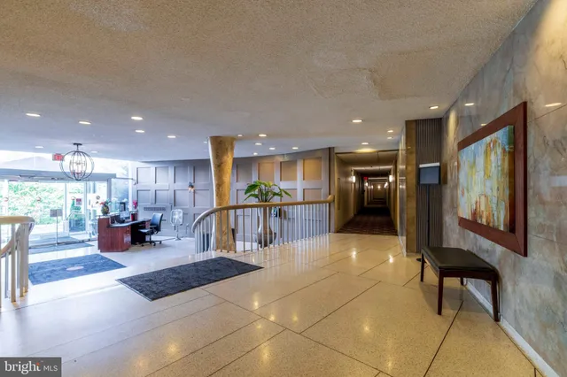 a lobby with furniture and a large window