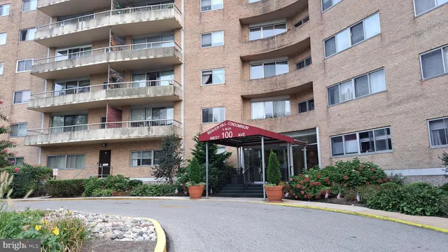 a view of a building with a lot of flower plants