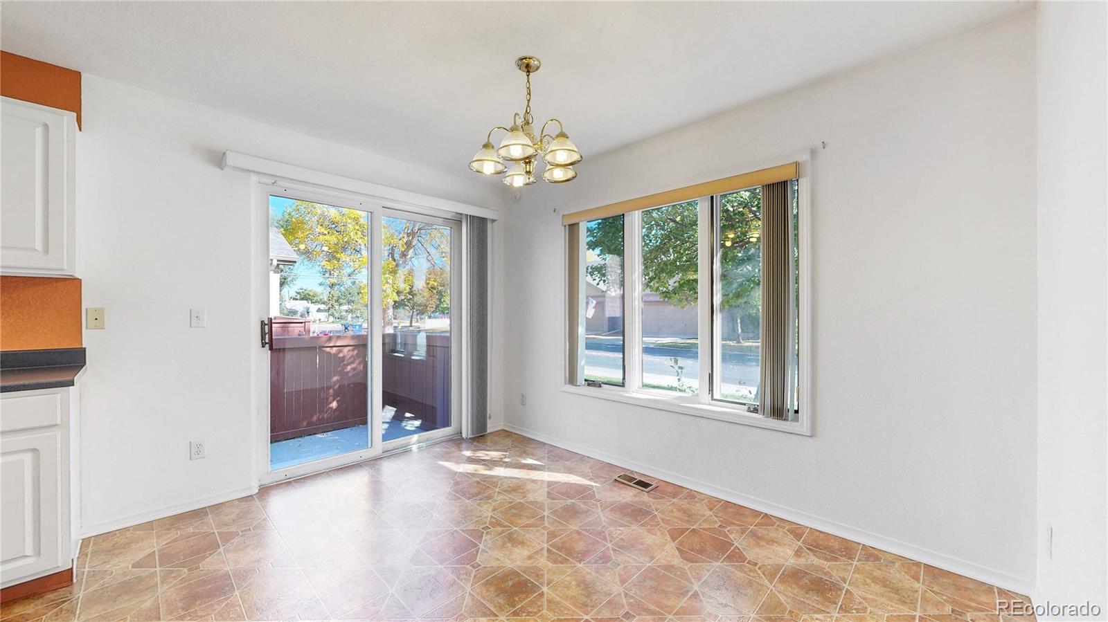 4367 Quail Street Wheat Ridge, CO 80033 - Photo 12 of 50 a view of an empty room with a window