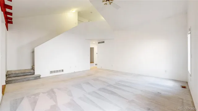 a view of empty room with a ceiling fan