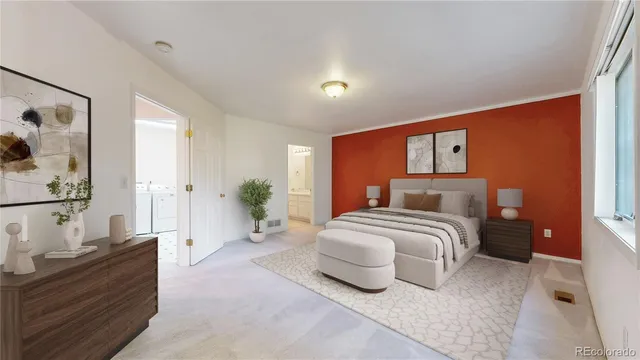 a bedroom with a large bed and a couch