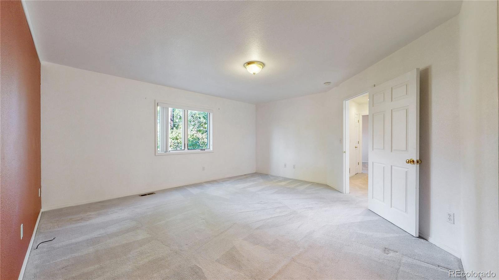 4367 Quail Street Wheat Ridge, CO 80033 - Photo 21 of 50 an empty room with windows