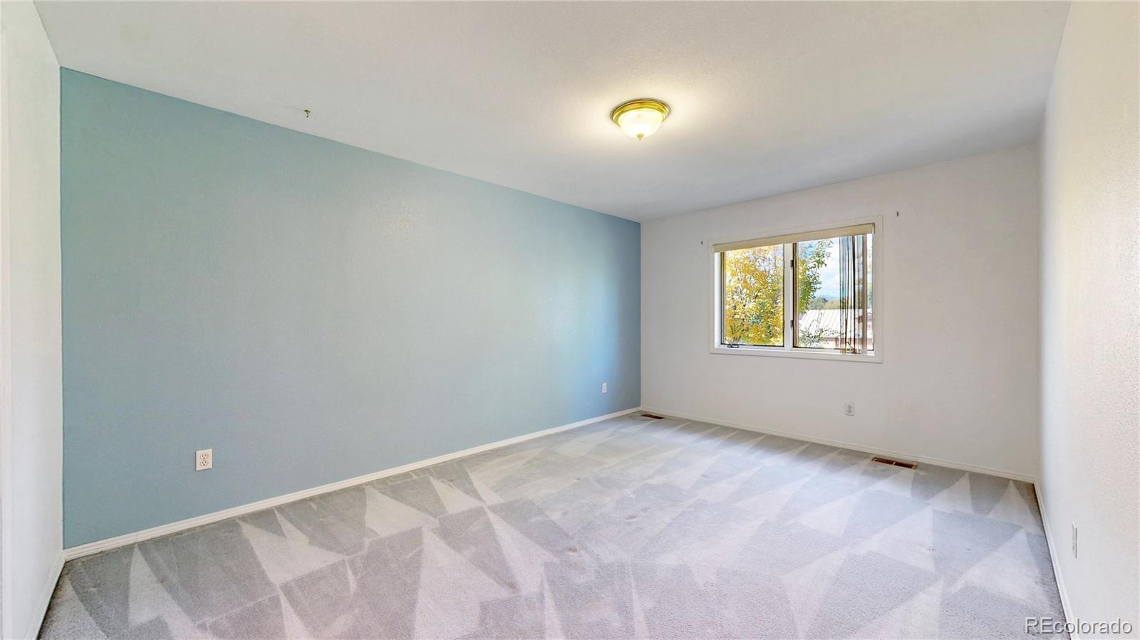 4367 Quail Street Wheat Ridge, CO 80033 - Photo 34 of 50 an empty room with windows