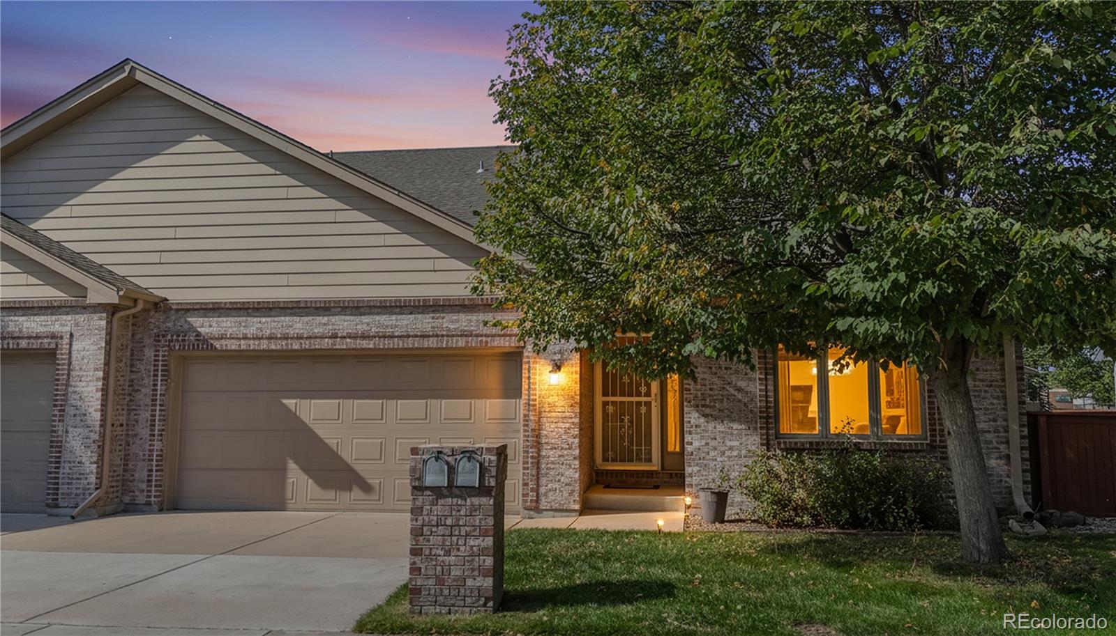 4367 Quail Street Wheat Ridge, CO 80033 - Photo 4 of 50 a front view of a house with garden