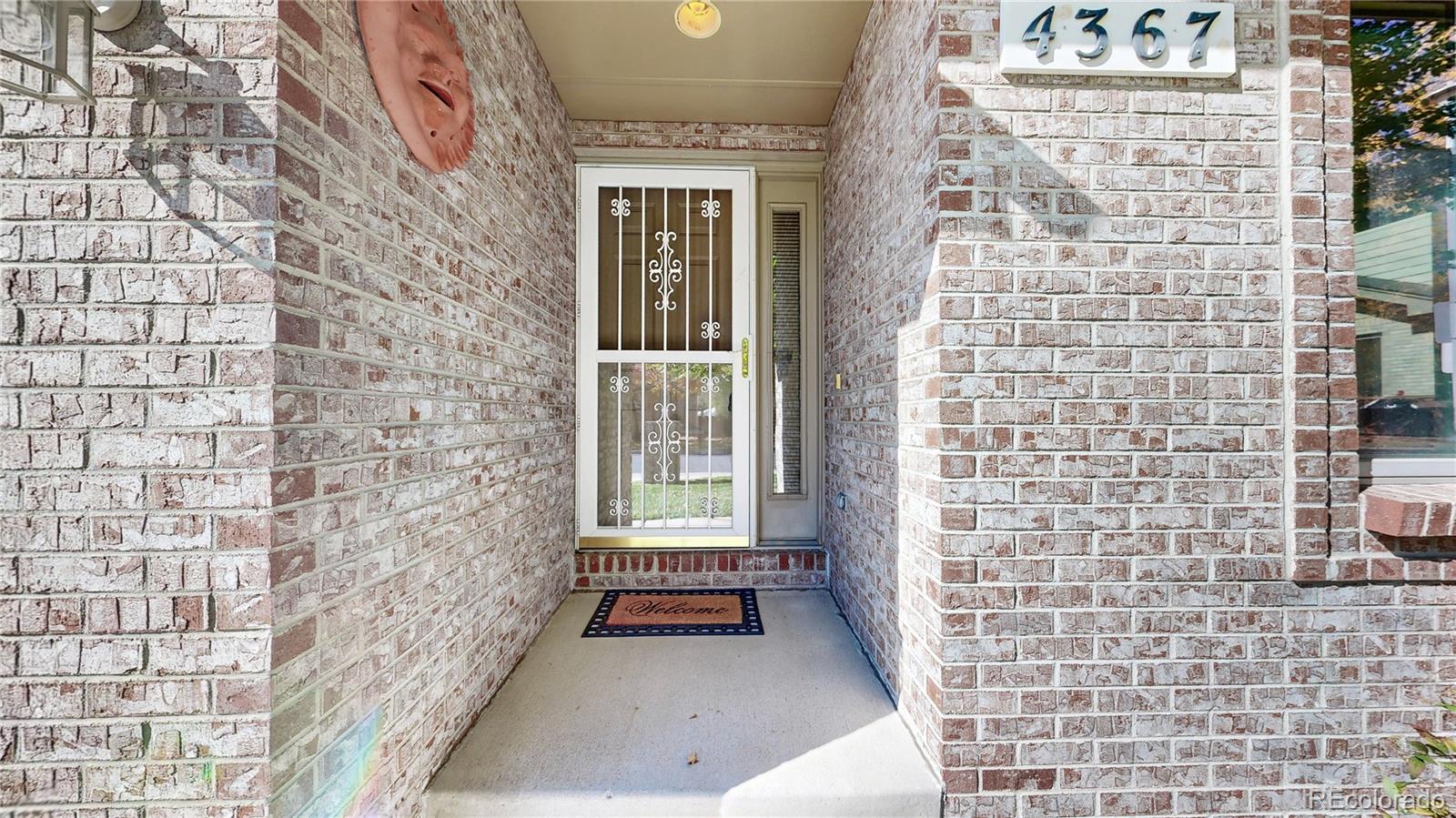 4367 Quail Street Wheat Ridge, CO 80033 - Photo 46 of 50 a view of a brick house with many windows