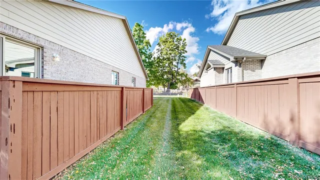 an aerial view of a house with a lake