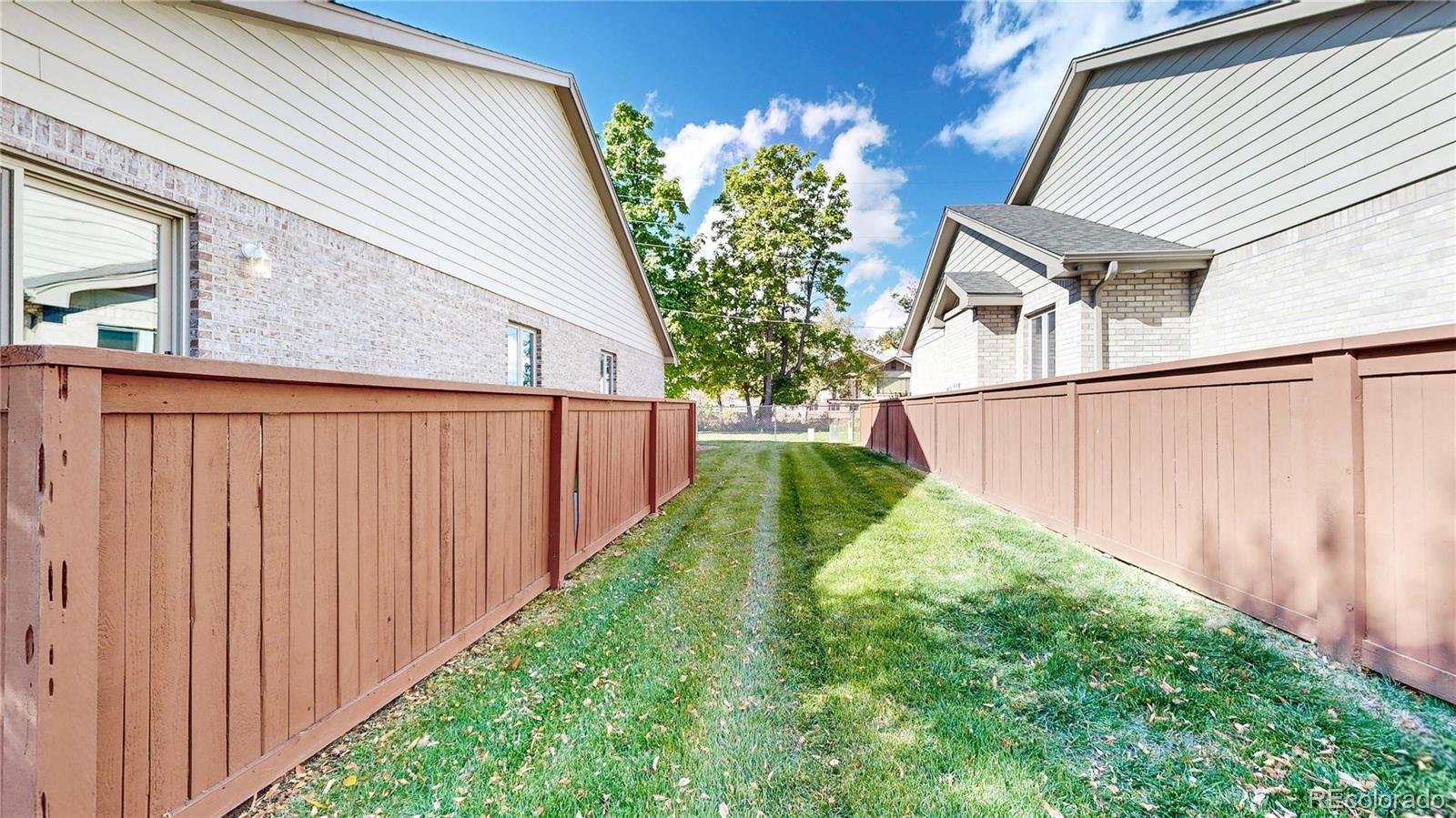 4367 Quail Street Wheat Ridge, CO 80033 - Photo 48 of 50 a view of a backyard of the house