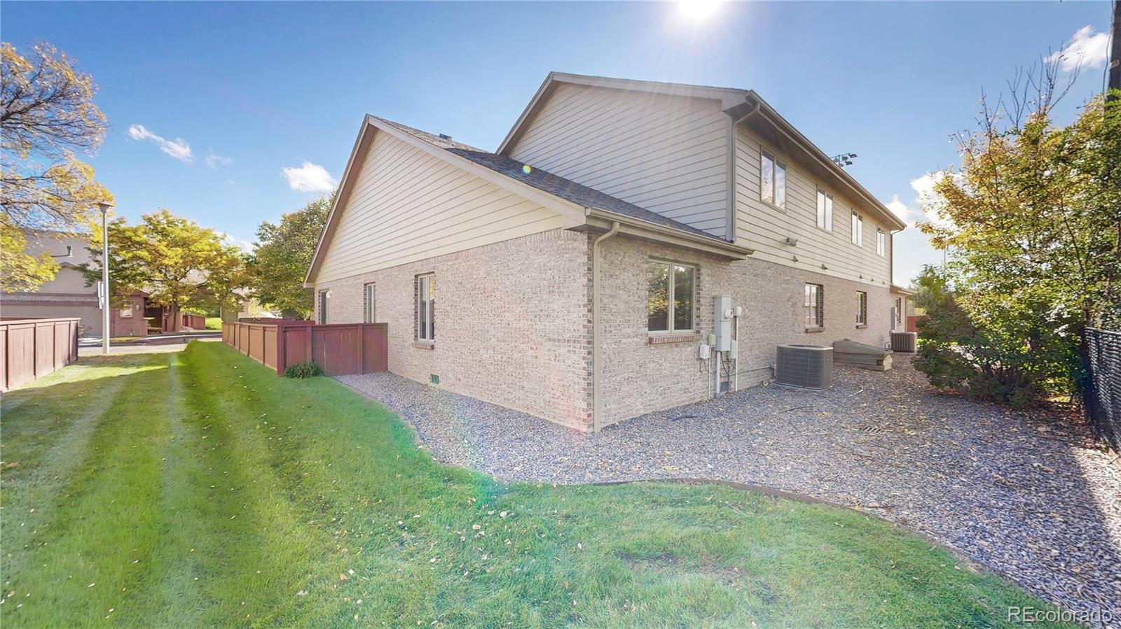 4367 Quail Street Wheat Ridge, CO 80033 - Photo 49 of 50 a view of a house with a yard