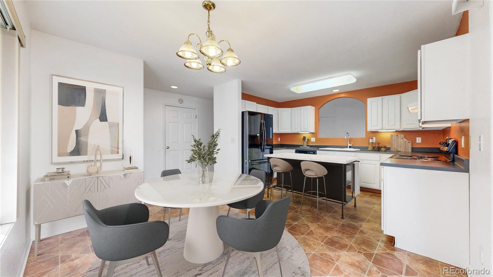 4367 Quail Street Wheat Ridge, CO 80033 - Photo 5 of 50 a kitchen with a table chairs and a dining table