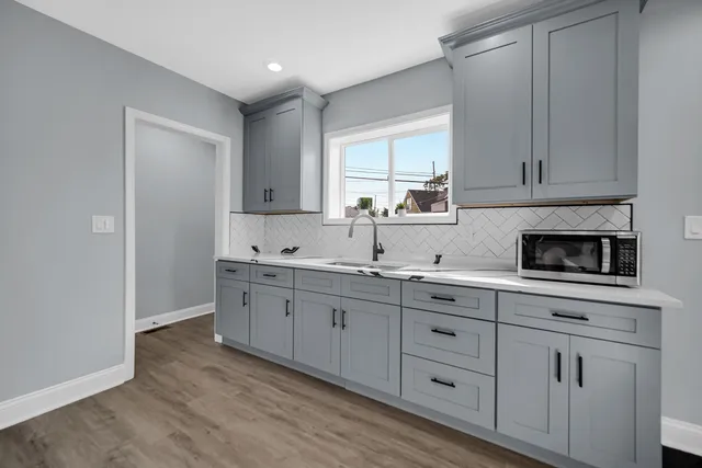 a kitchen with sink cabinets and window