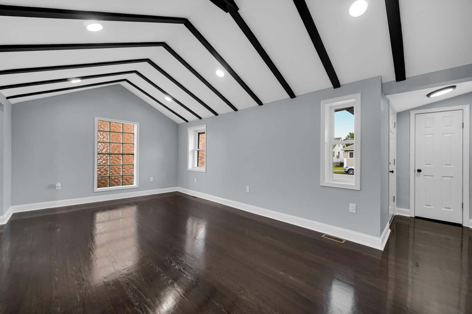 1430 Stanton Avenue Whiting, IN 46394 - Photo 7 of 17 a view of an empty room with wooden floor and windows