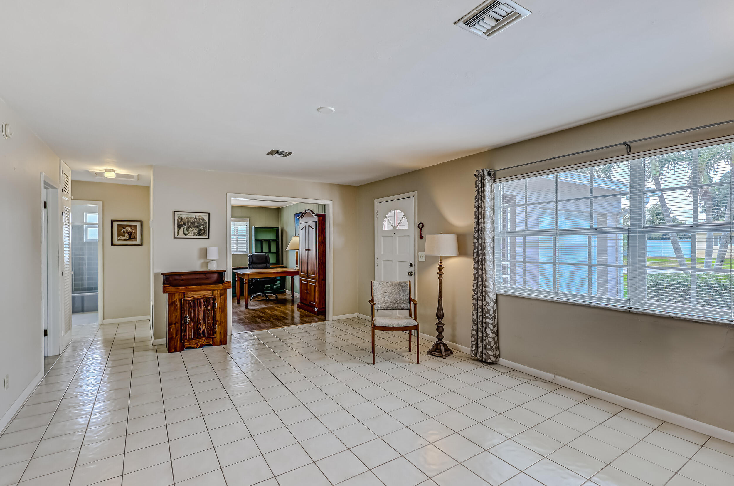 1618 Maypop Road West Palm Beach, FL 33415 - Photo 13 of 81 a view of empty room with wooden floor and furniture