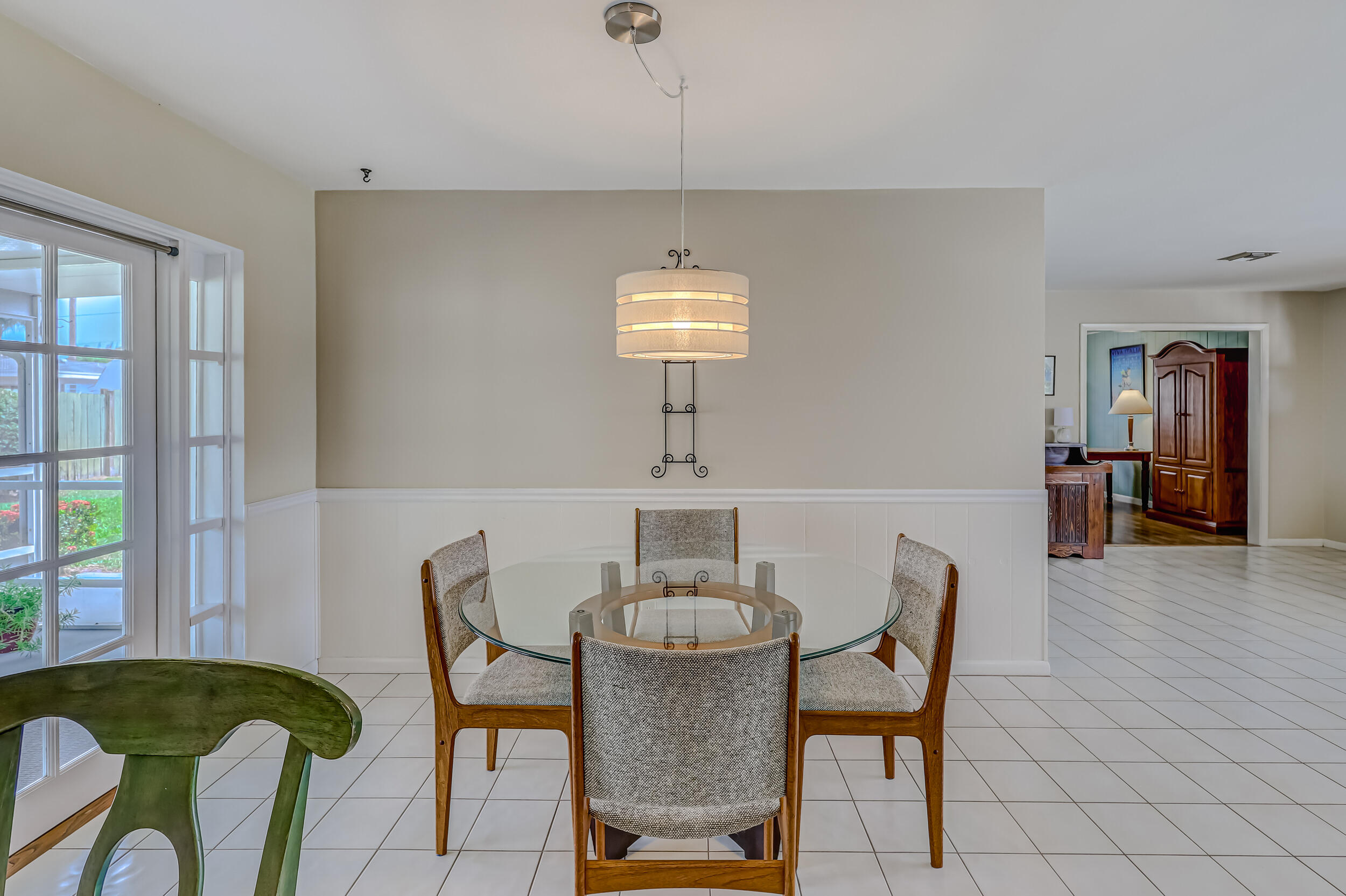 1618 Maypop Road West Palm Beach, FL 33415 - Photo 21 of 81 a view of a dining room with furniture and wooden floor