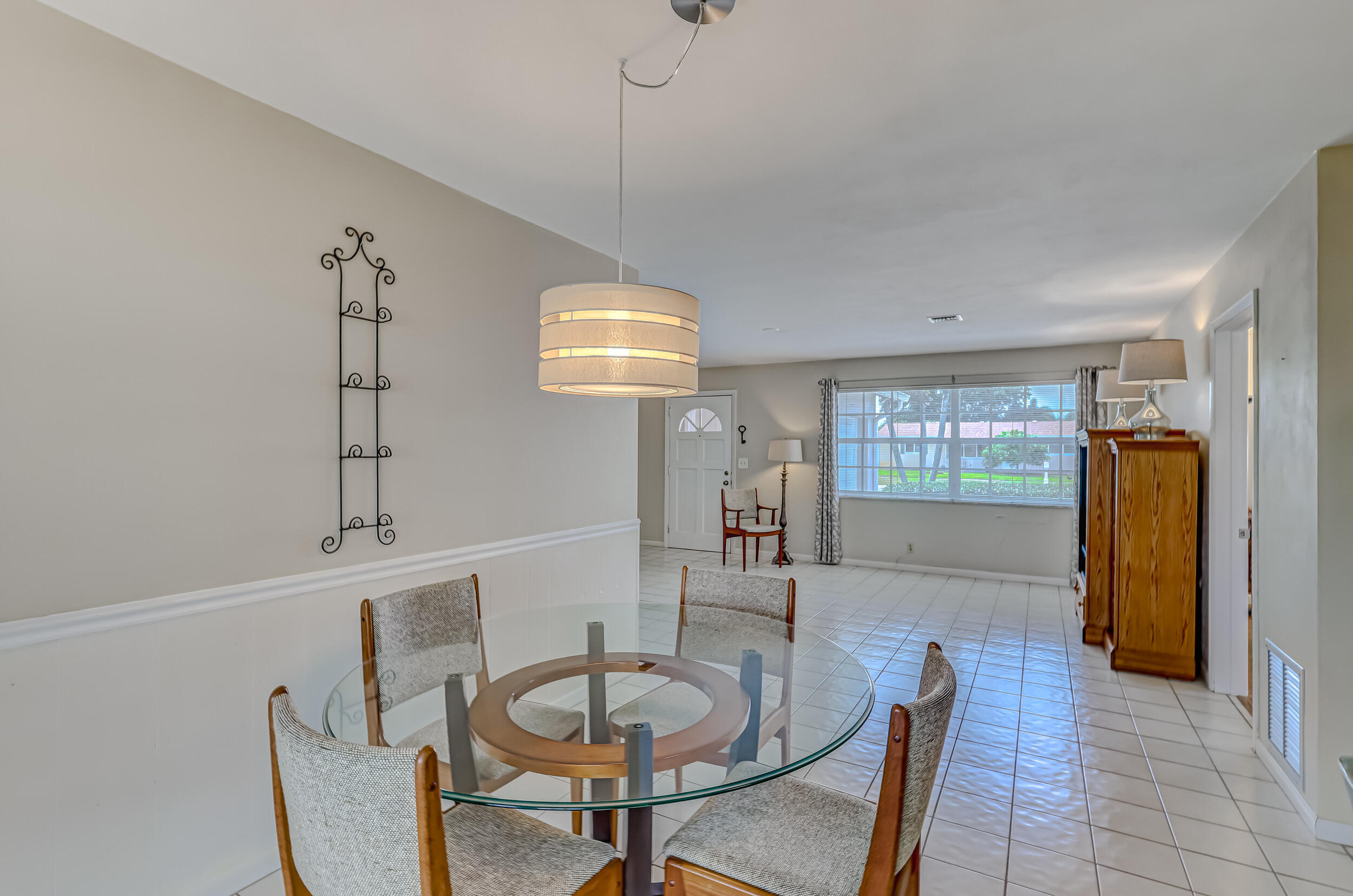 1618 Maypop Road West Palm Beach, FL 33415 - Photo 22 of 81 a dining room with furniture and window