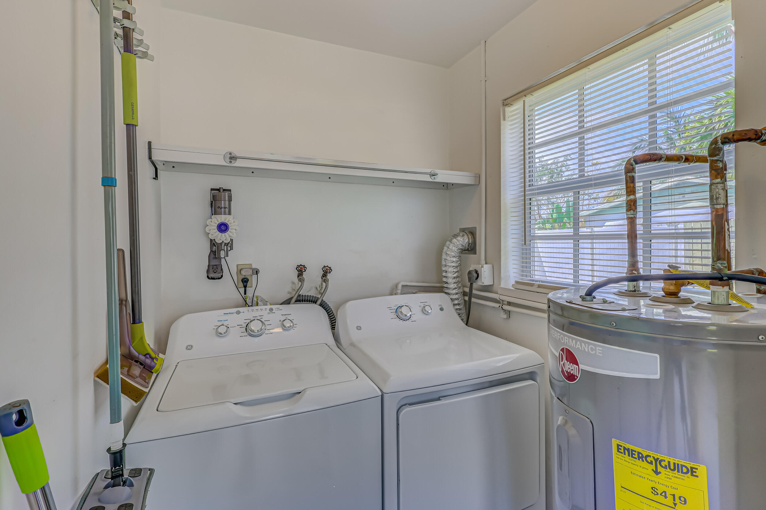 1618 Maypop Road West Palm Beach, FL 33415 - Photo 32 of 81 a utility room with dryer and washer