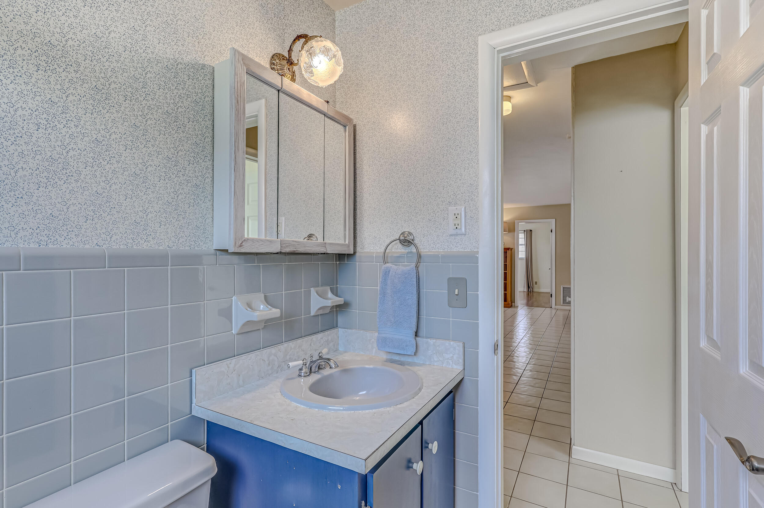 1618 Maypop Road West Palm Beach, FL 33415 - Photo 36 of 81 a bathroom with a sink a toilet and shower