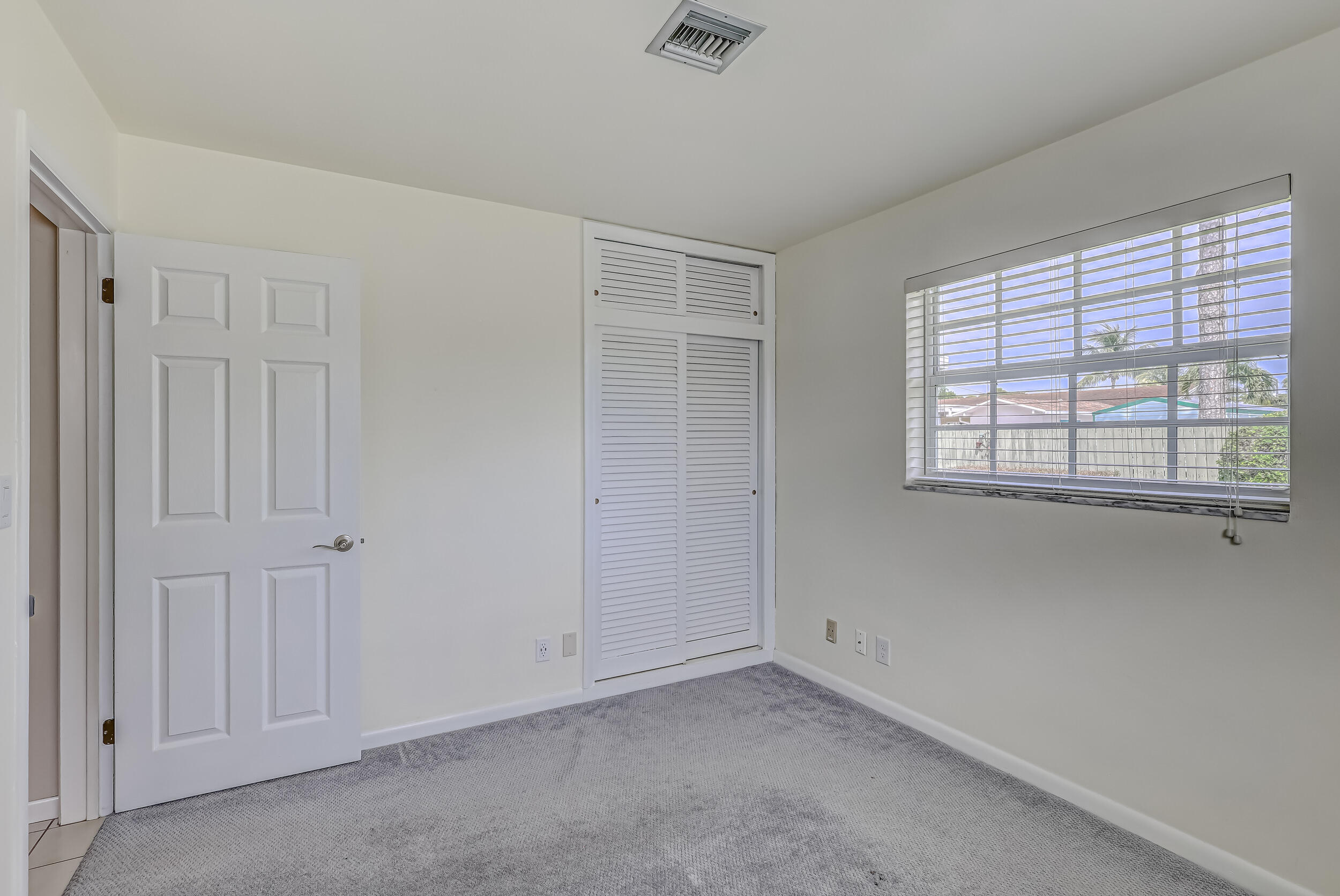 1618 Maypop Road West Palm Beach, FL 33415 - Photo 38 of 81 a view of an empty room with a window