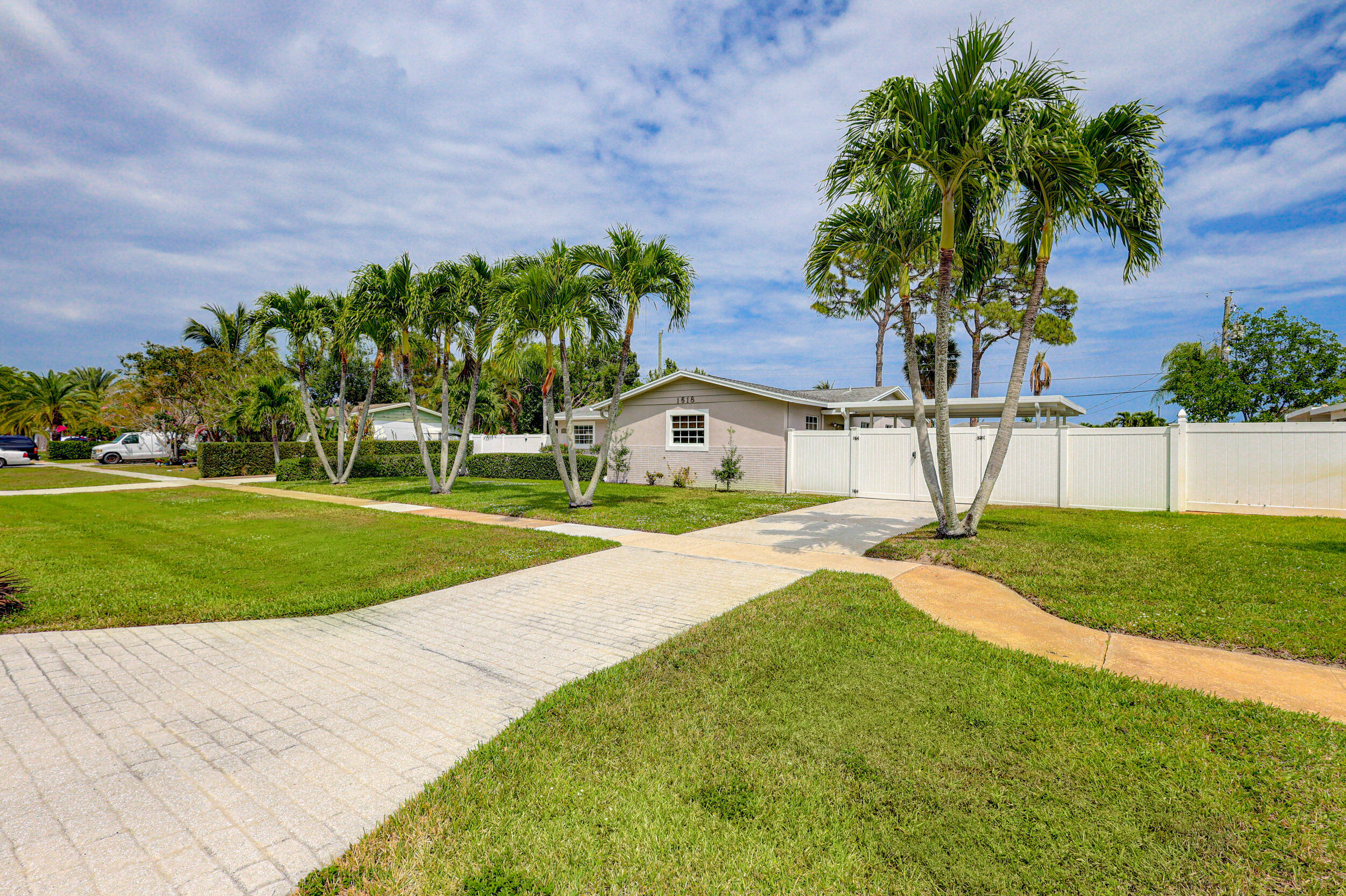 1618 Maypop Road West Palm Beach, FL 33415 - Photo 4 of 81 a view of a house with a yard and a garden
