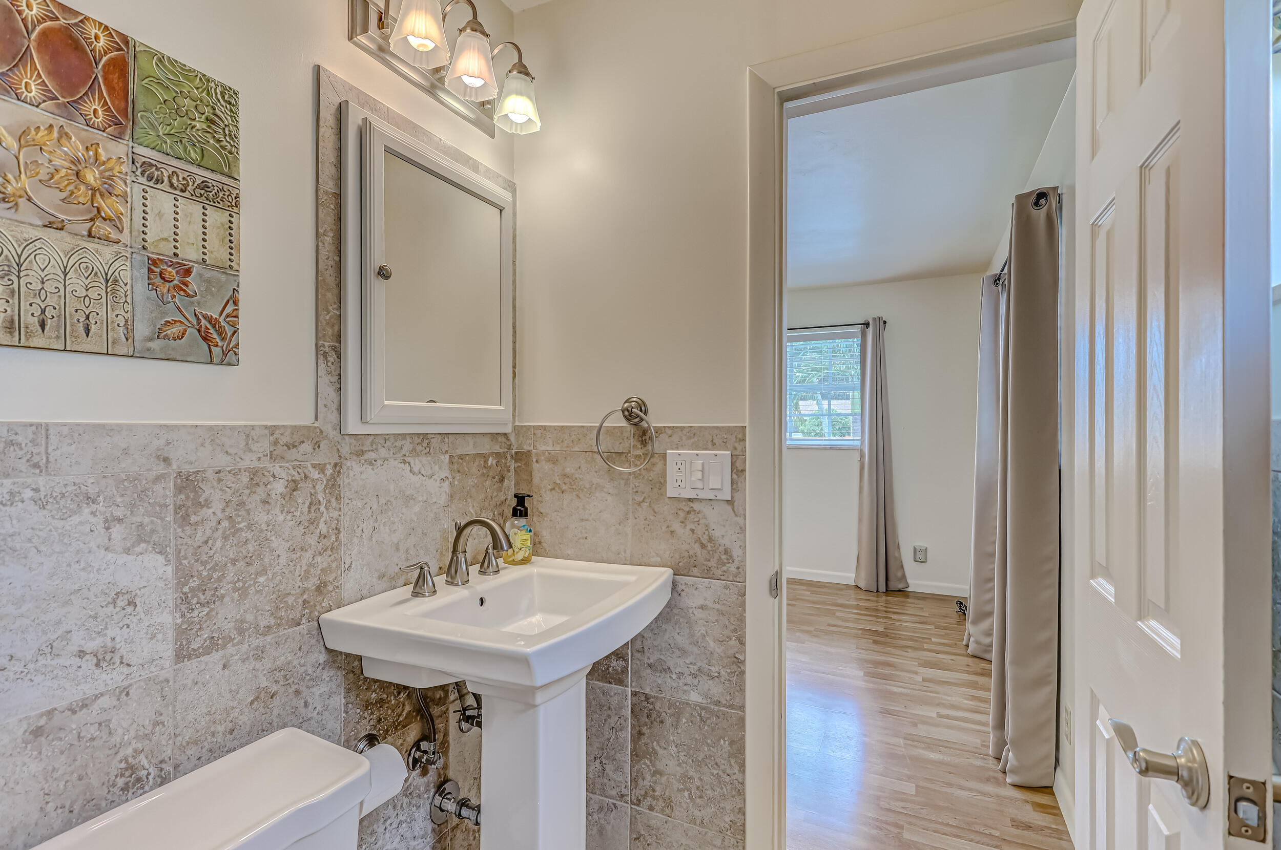 1618 Maypop Road West Palm Beach, FL 33415 - Photo 44 of 81 a bathroom with a sink and a mirror