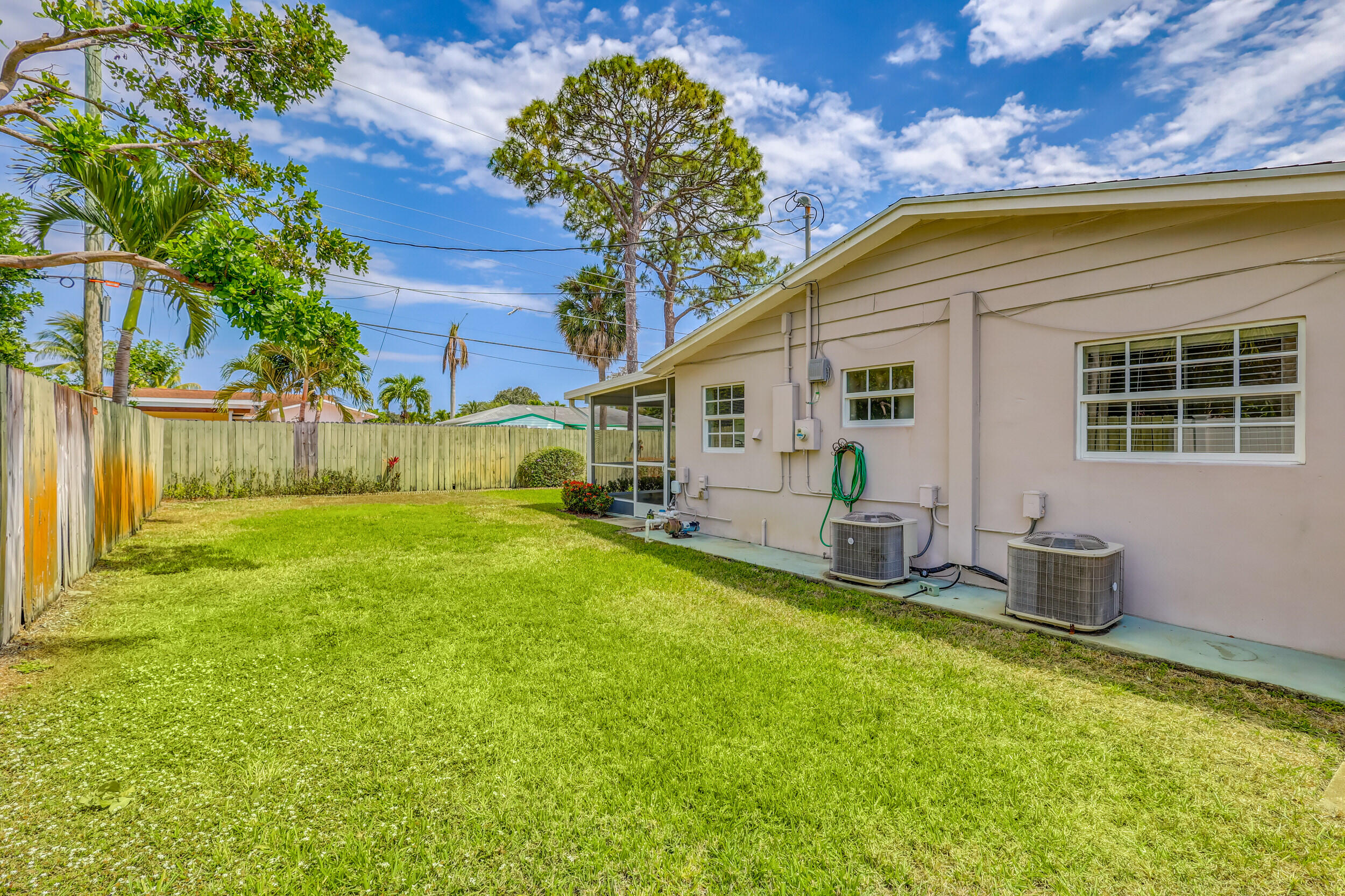 1618 Maypop Road West Palm Beach, FL 33415 - Photo 52 of 81 a view of a house with backyard and sitting area
