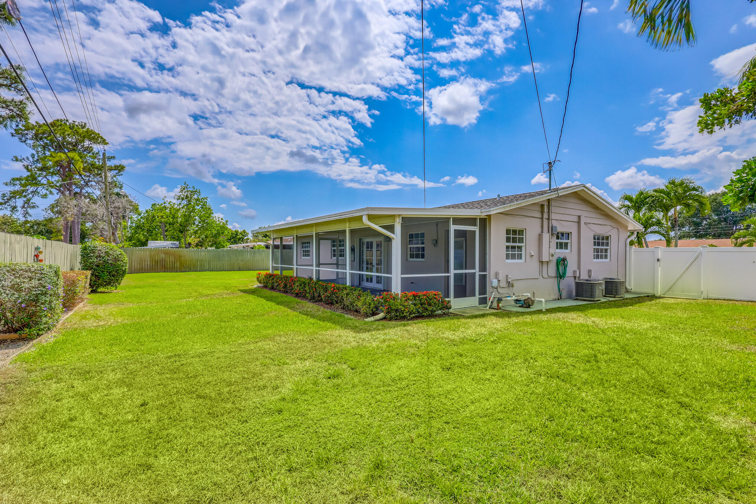 1618 Maypop Road West Palm Beach, FL 33415 - Photo 54 of 81 a view of a house with a backyard