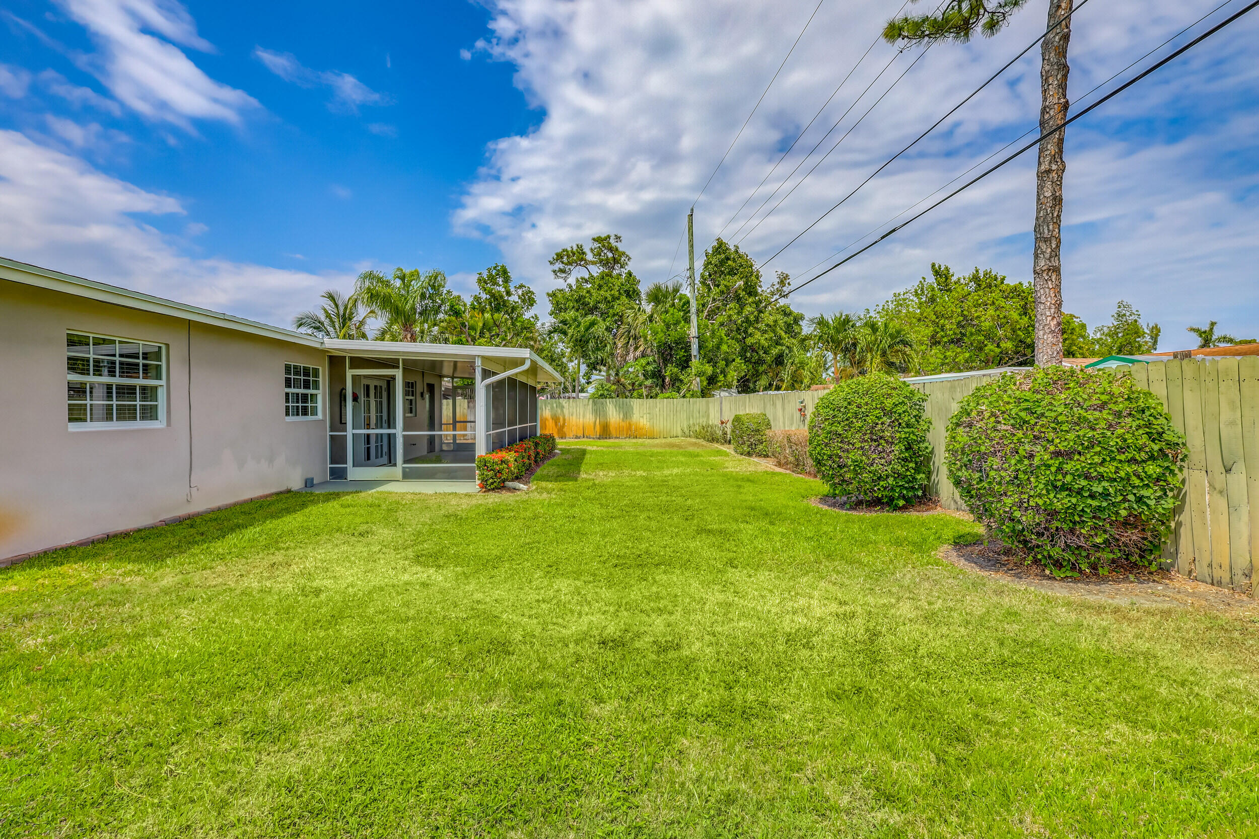1618 Maypop Road West Palm Beach, FL 33415 - Photo 57 of 81 a view of a house with a backyard