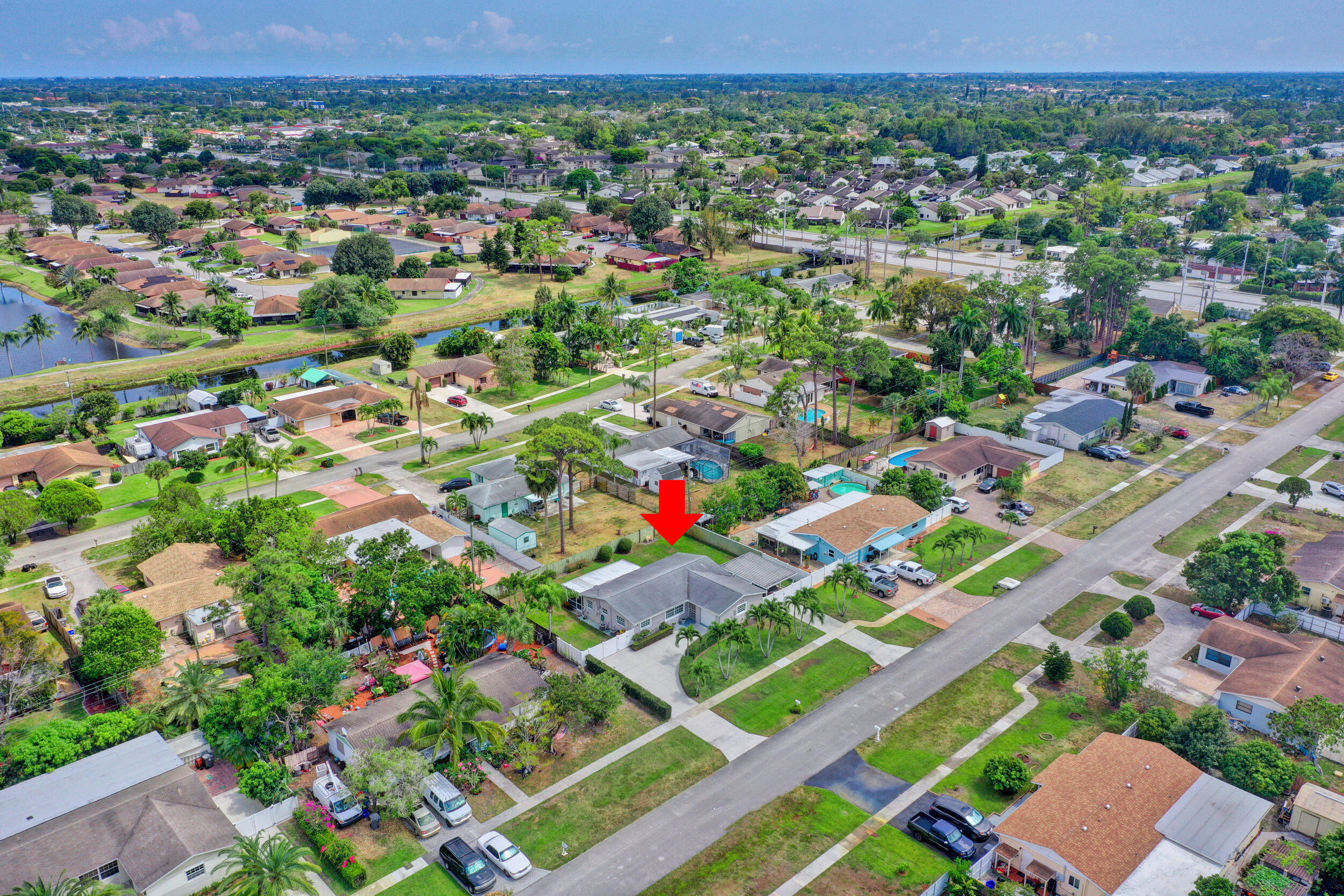 1618 Maypop Road West Palm Beach, FL 33415 - Photo 74 of 81 an aerial view of residential houses with outdoor space and street view