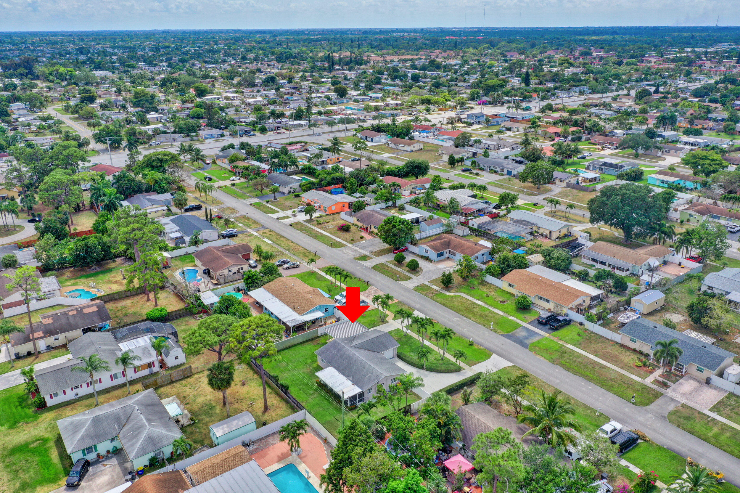 1618 Maypop Road West Palm Beach, FL 33415 - Photo 75 of 81 an aerial view of residential houses with outdoor space and street view