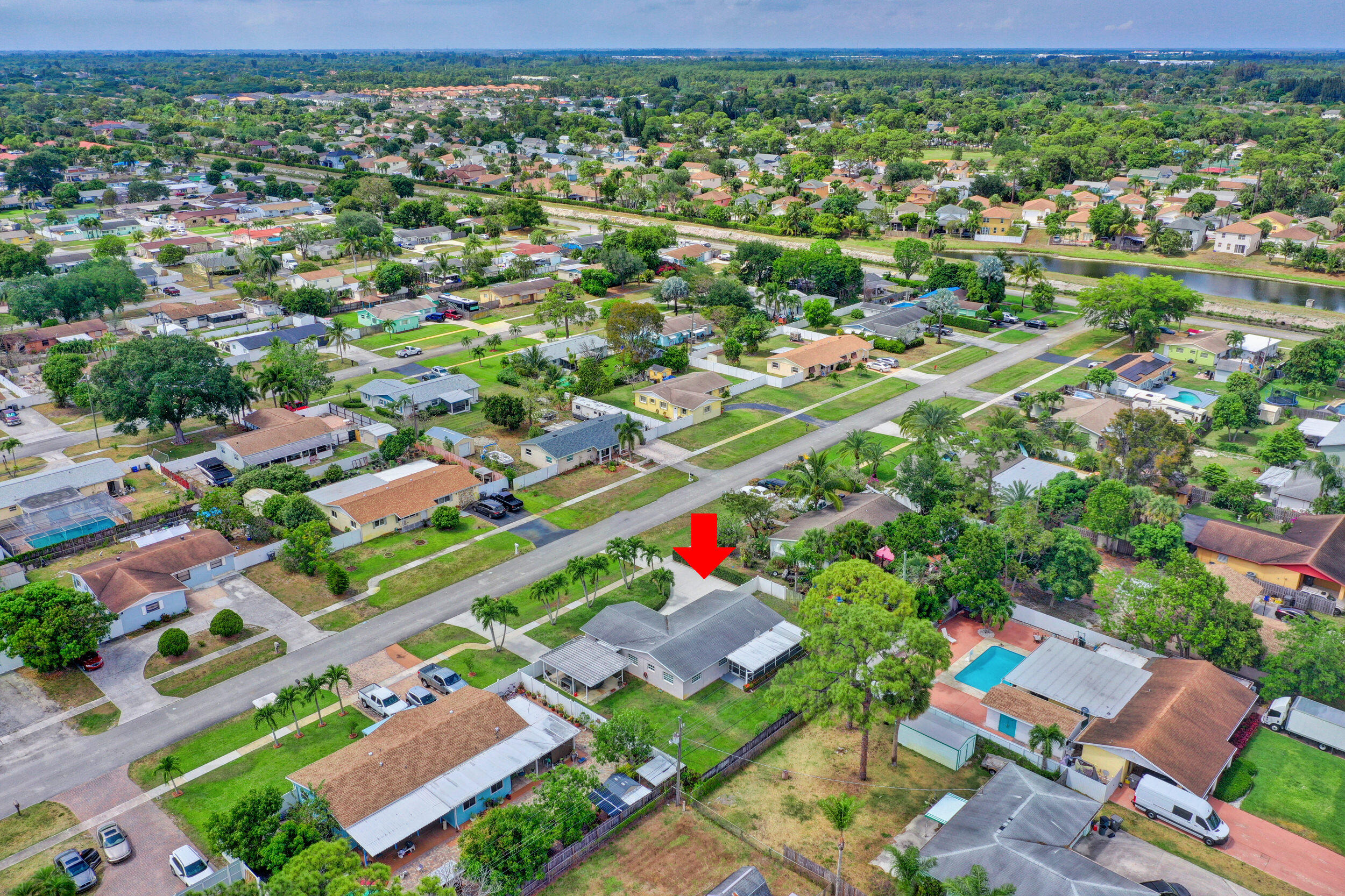 1618 Maypop Road West Palm Beach, FL 33415 - Photo 77 of 81 an aerial view of residential houses with outdoor space and street view