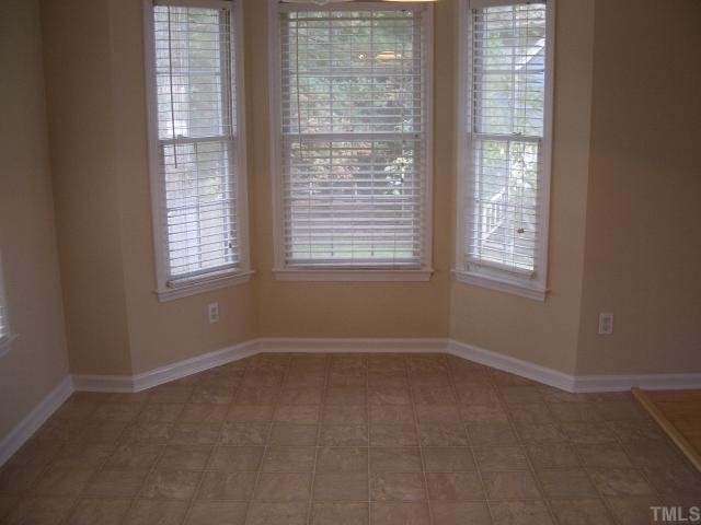 7301 Massachusetts Court Raleigh, NC 27615 - Photo 6 of 12 a view of an empty room with a window