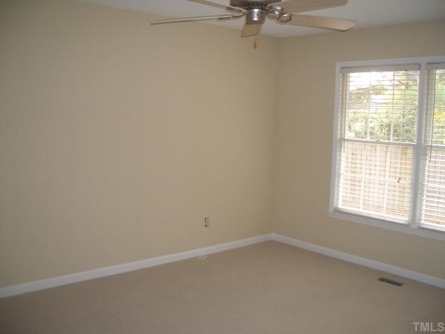 7301 Massachusetts Court Raleigh, NC 27615 - Photo 7 of 12 an empty room with a window