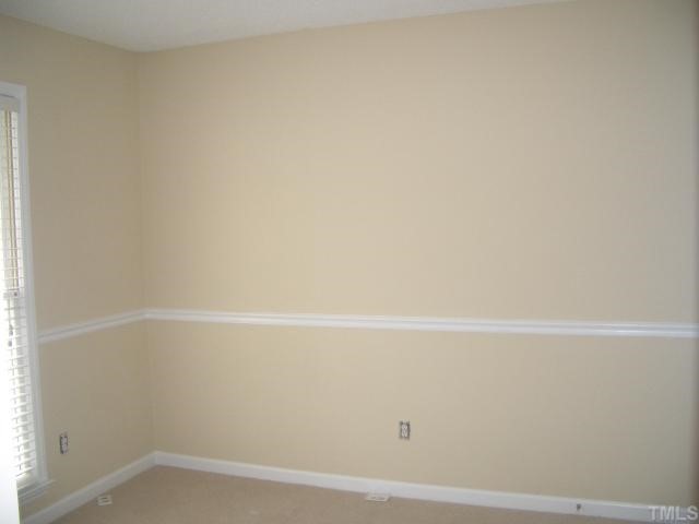 7301 Massachusetts Court Raleigh, NC 27615 - Photo 10 of 12 a view of an empty room
