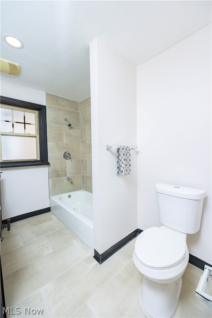 3254 Redwood Road Cleveland Heights, OH 44118 - Photo 40 of 49 Bathroom with toilet, tiled shower / bath, and tile flooring