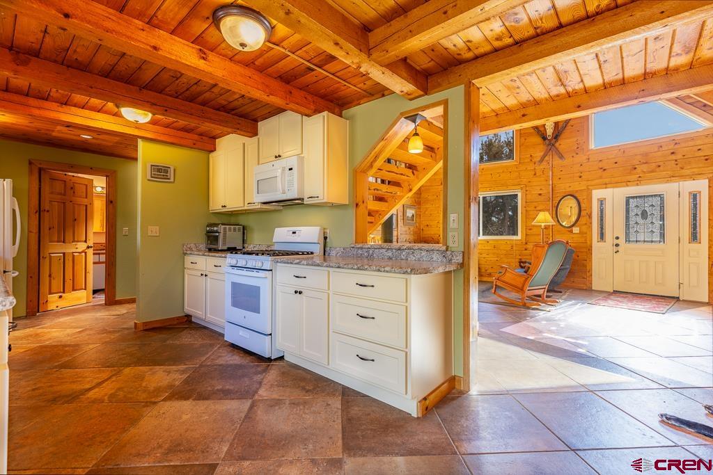 349 Mariposa Drive Durango, CO 81301 - Photo 12 of 34 a kitchen with cabinets and wooden floor