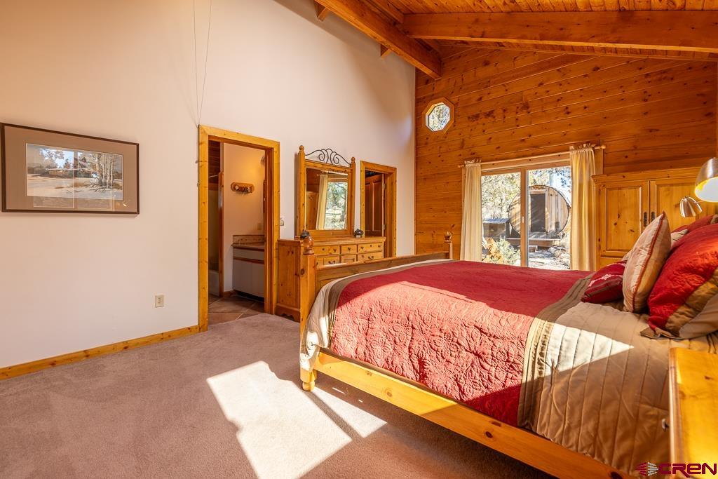 349 Mariposa Drive Durango, CO 81301 - Photo 13 of 34 a bed sitting in a bedroom next to a window