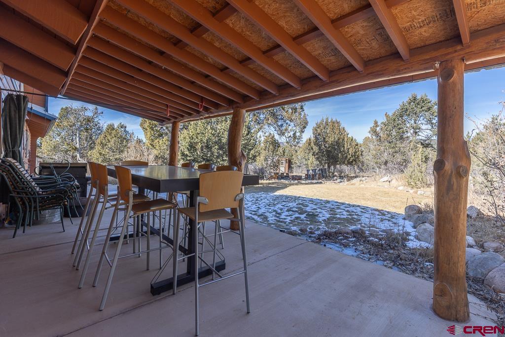 349 Mariposa Drive Durango, CO 81301 - Photo 24 of 34 a view of a swimming pool with a table and chairs in patio