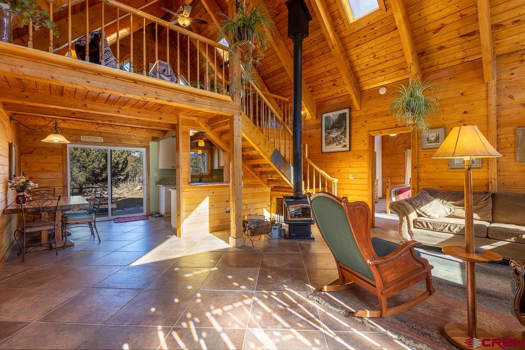 349 Mariposa Drive Durango, CO 81301 - Photo 6 of 34 a view of a patio with couches table and chairs and potted plants