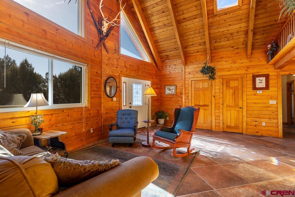 349 Mariposa Drive Durango, CO 81301 - Photo 8 of 34 a backyard of a house with sofas table and chairs