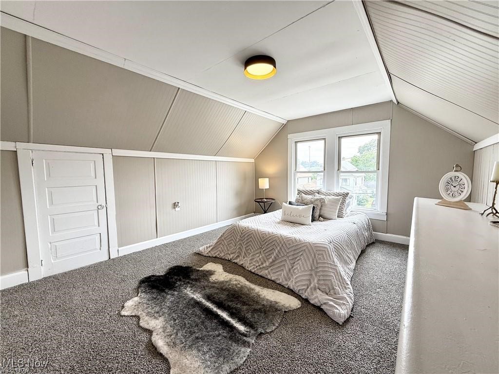 281 Sexton Street Struthers, OH 44471 - Photo 21 of 28 Carpeted bedroom featuring baseboards and vaulted ceiling