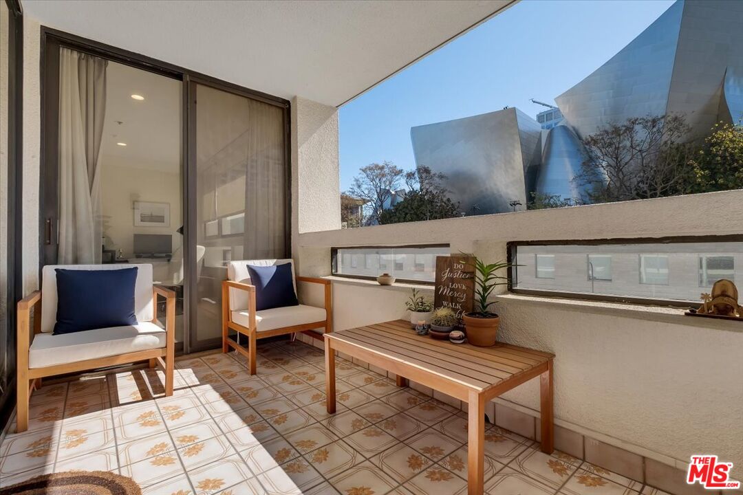 121 South Hope Street, Unit 313 Los Angeles, CA 90012 - Photo 12 of 35 a living room with furniture