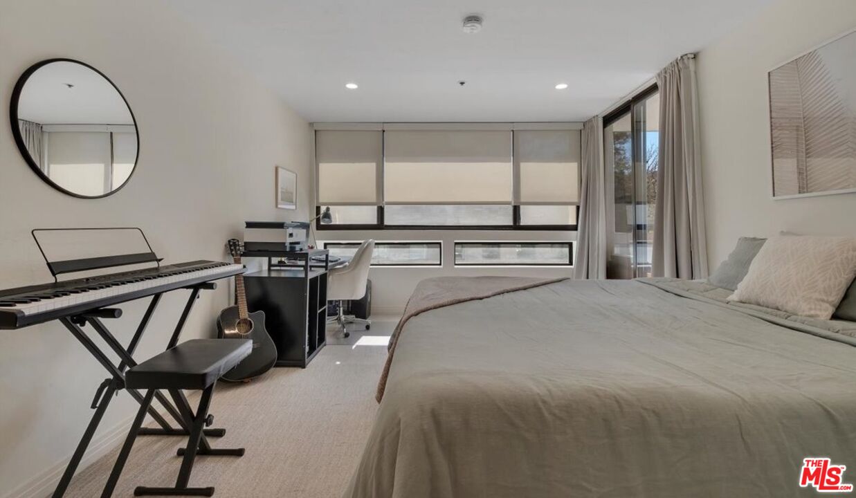 121 South Hope Street, Unit 313 Los Angeles, CA 90012 - Photo 14 of 35 a view of a livingroom with furniture and a mirror