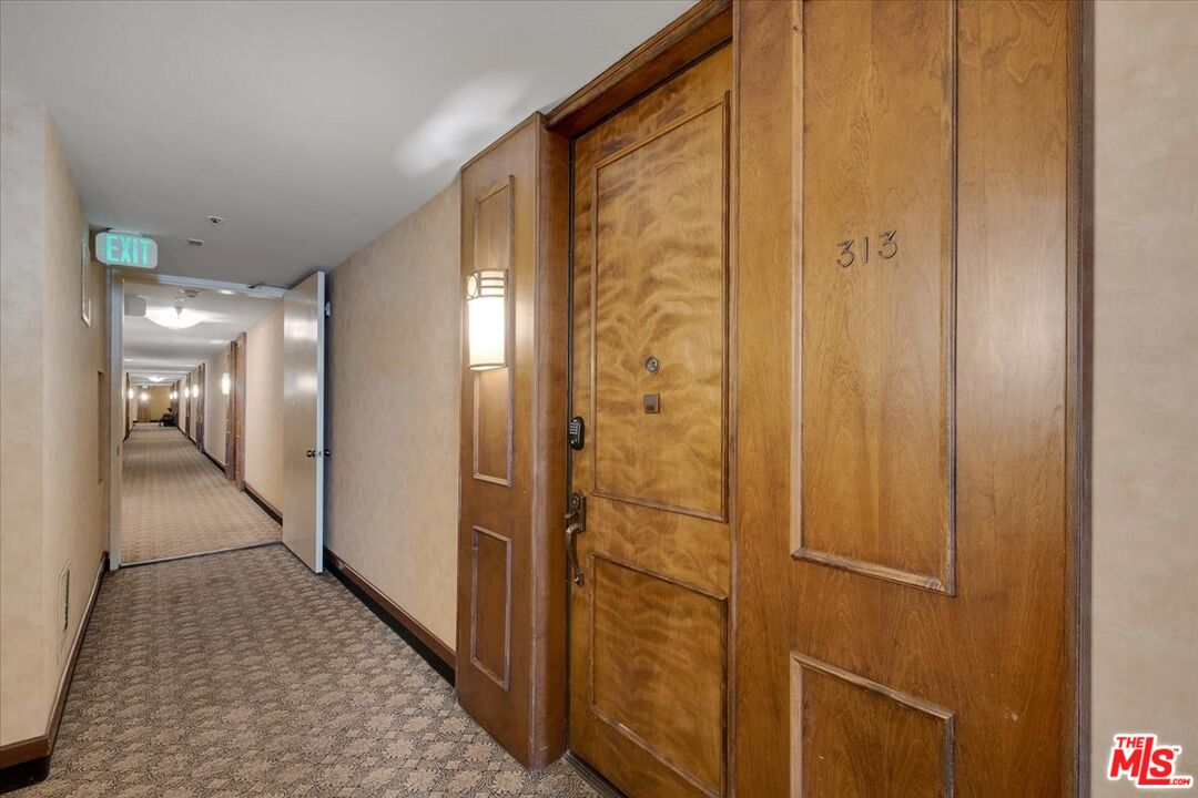 121 South Hope Street, Unit 313 Los Angeles, CA 90012 - Photo 20 of 35 a view of hallway with a bathroom and a shower