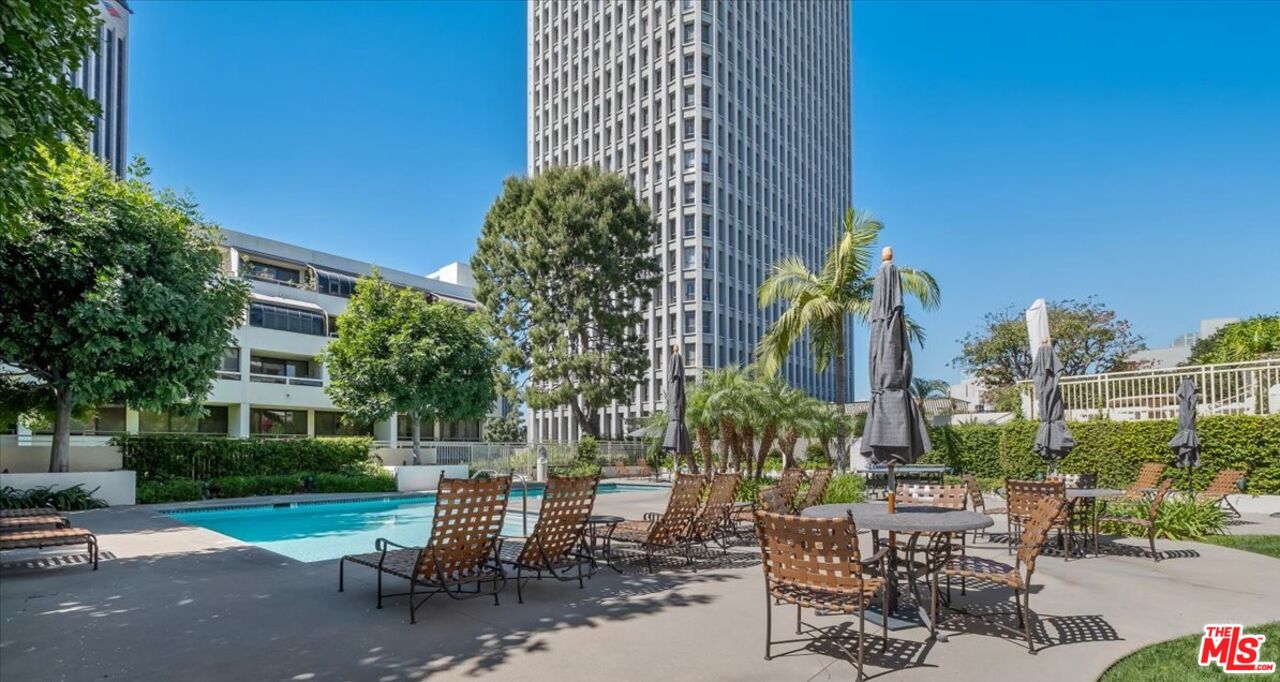 121 South Hope Street, Unit 313 Los Angeles, CA 90012 - Photo 25 of 35 a view of a chairs and table in the patio