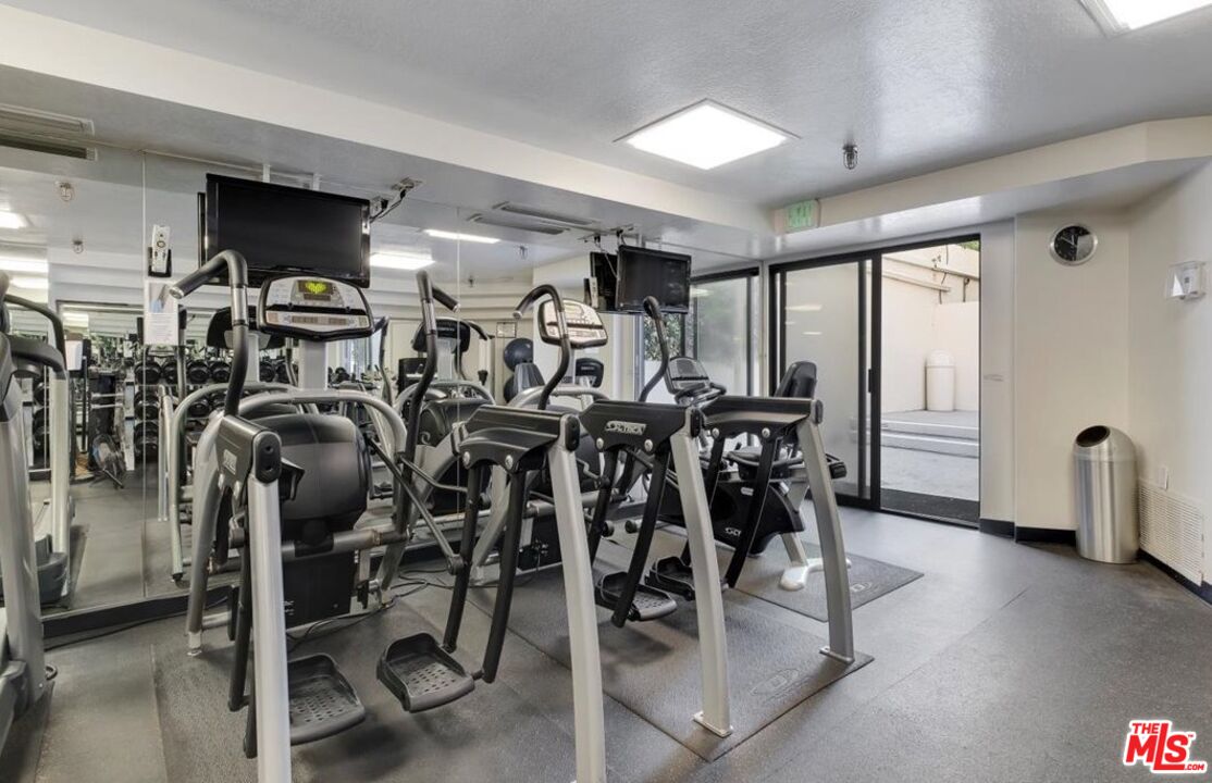 121 South Hope Street, Unit 313 Los Angeles, CA 90012 - Photo 27 of 35 a view of a room with gym equipment
