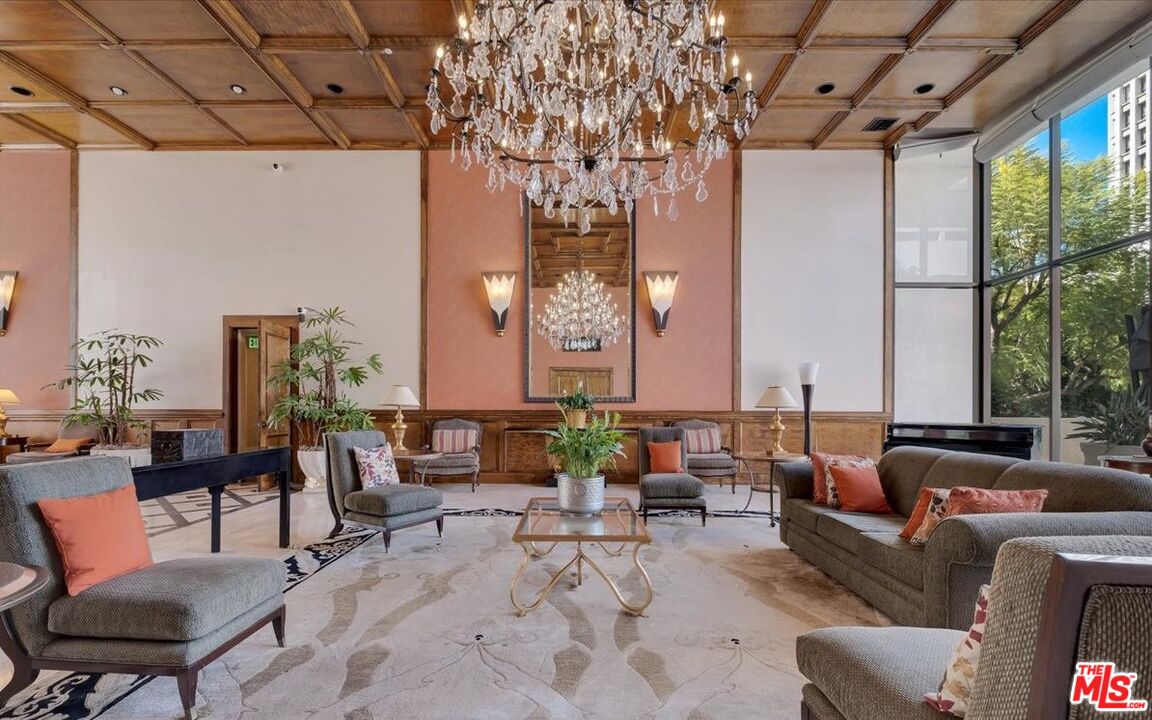 121 South Hope Street, Unit 313 Los Angeles, CA 90012 - Photo 29 of 35 a living room with furniture and a large window