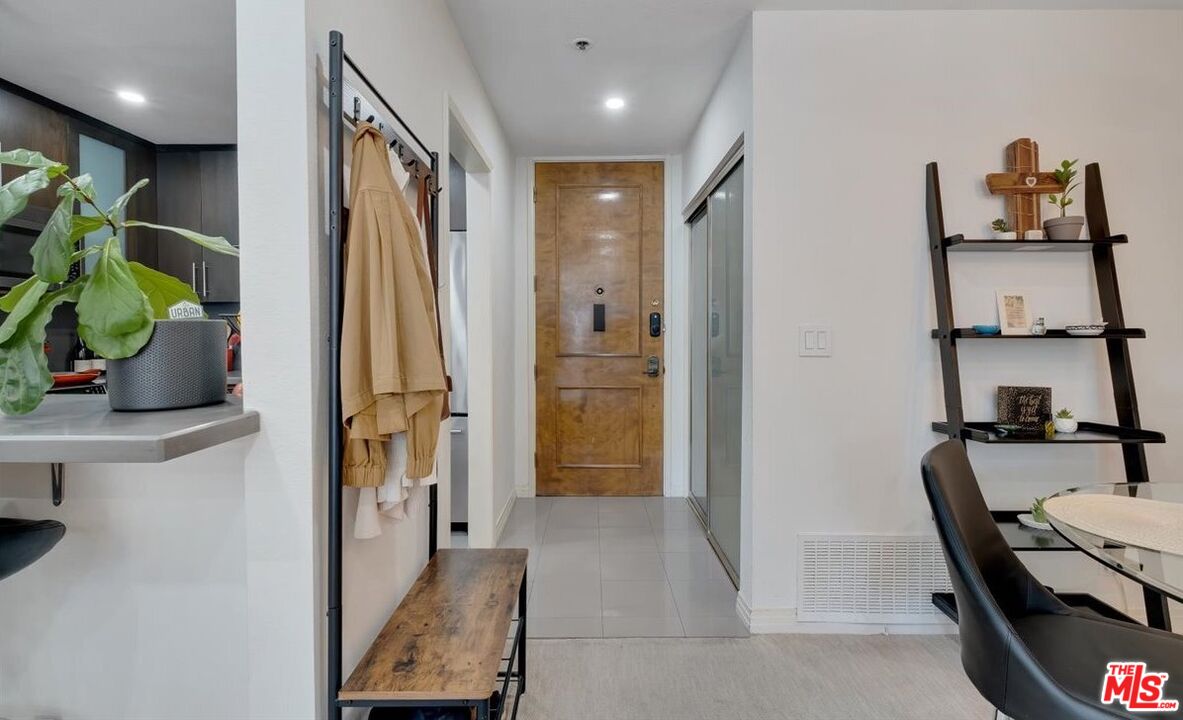 121 South Hope Street, Unit 313 Los Angeles, CA 90012 - Photo 4 of 35 a view of a hallway and dining room